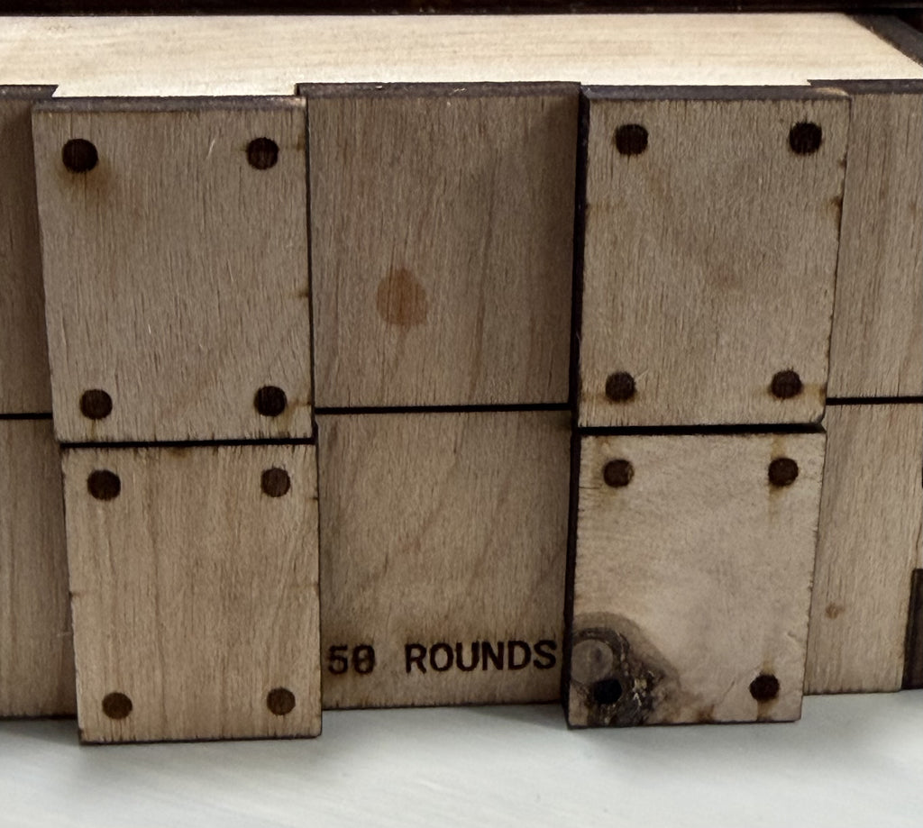 Wooden crate side engraved 50 ROUNDS; wooden storage accessory sold empty.