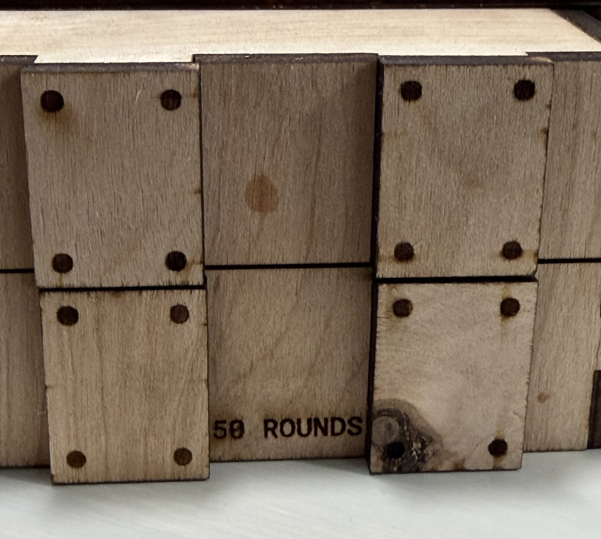 Wooden crate side engraved 50 ROUNDS; wooden storage accessory sold empty.