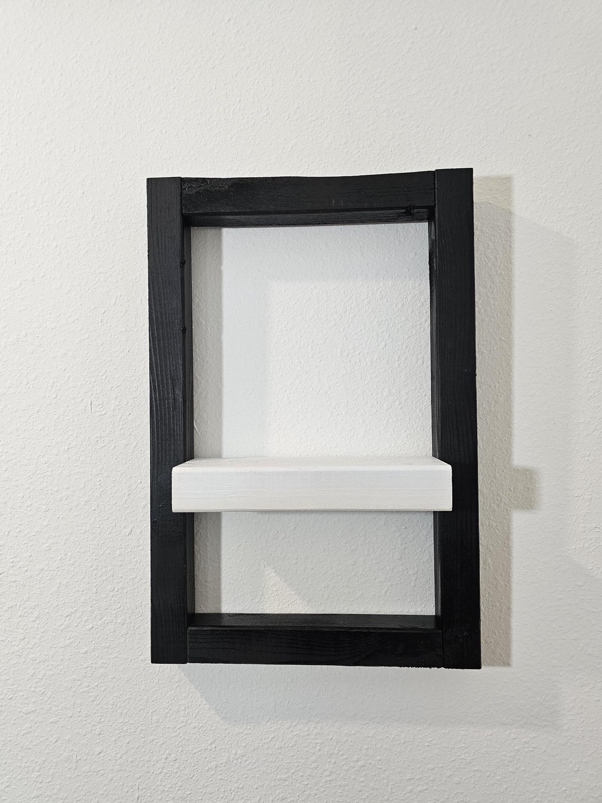 Handmade wall shelf with black pine frame and white ledge